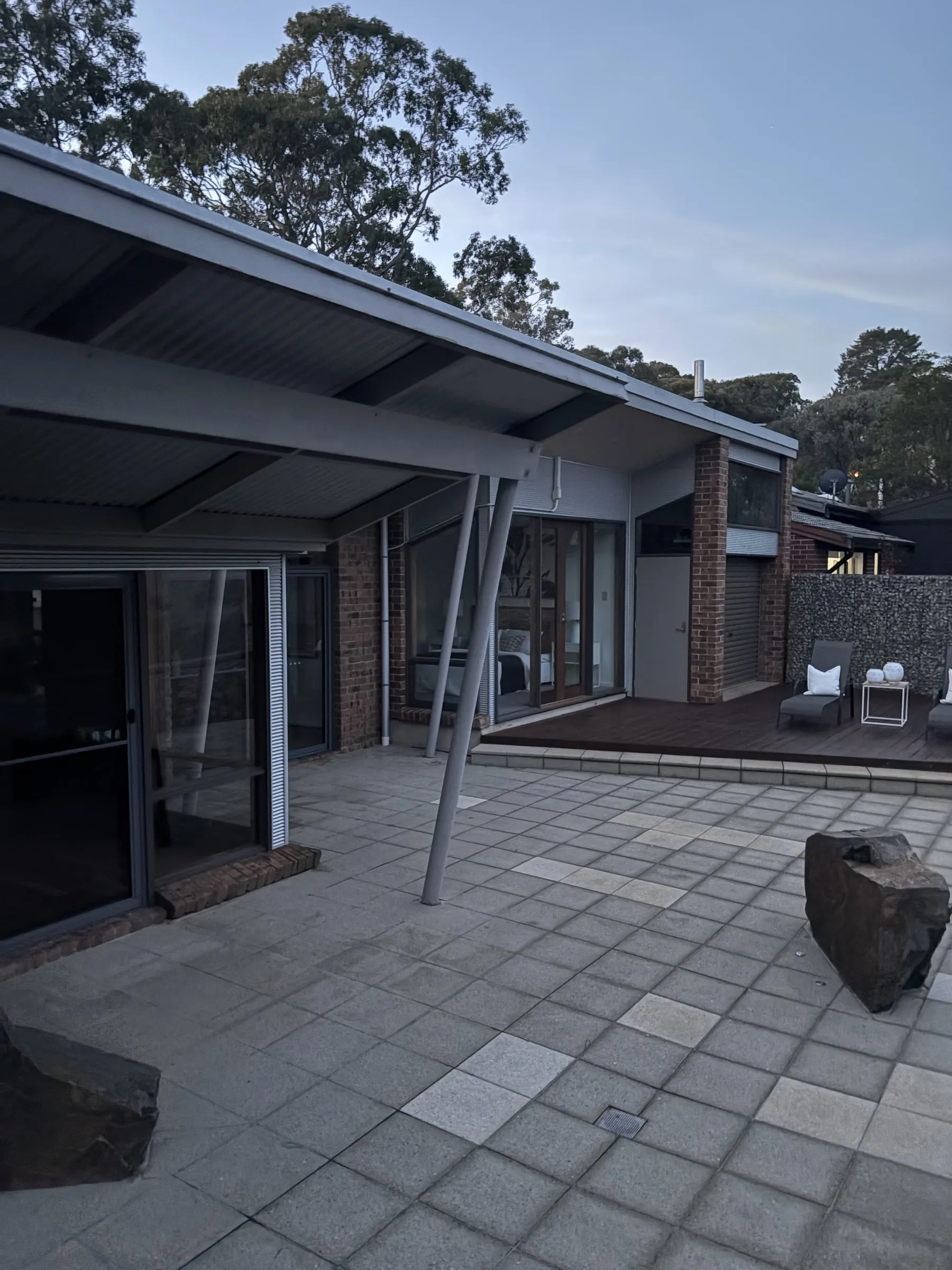 Courtyard with clean sliding glass doors at dusk